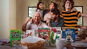 Image of family with Kellogg cereal boxes