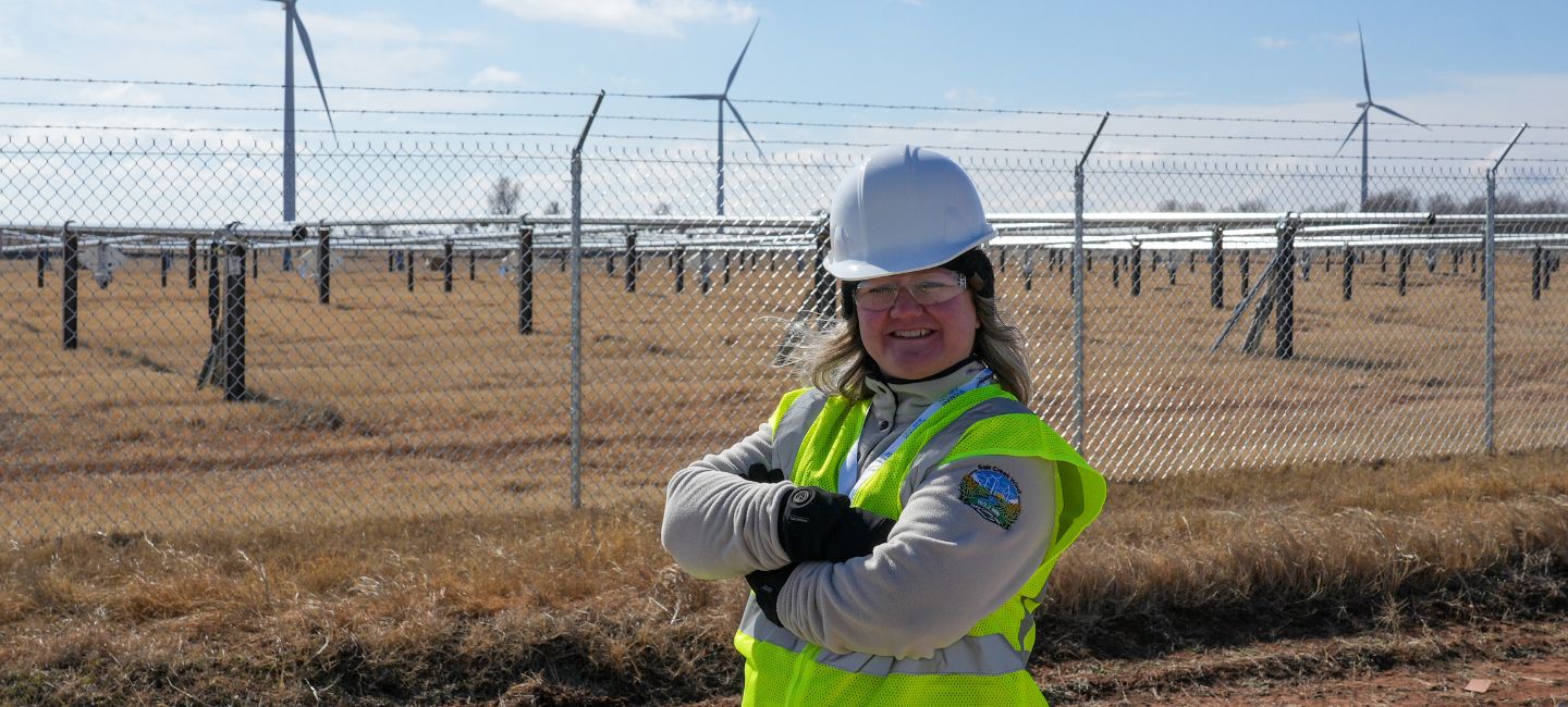 Megan Murphy Salyer in front of wind turbines