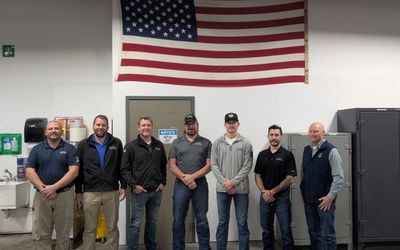 Men standing and smiling 